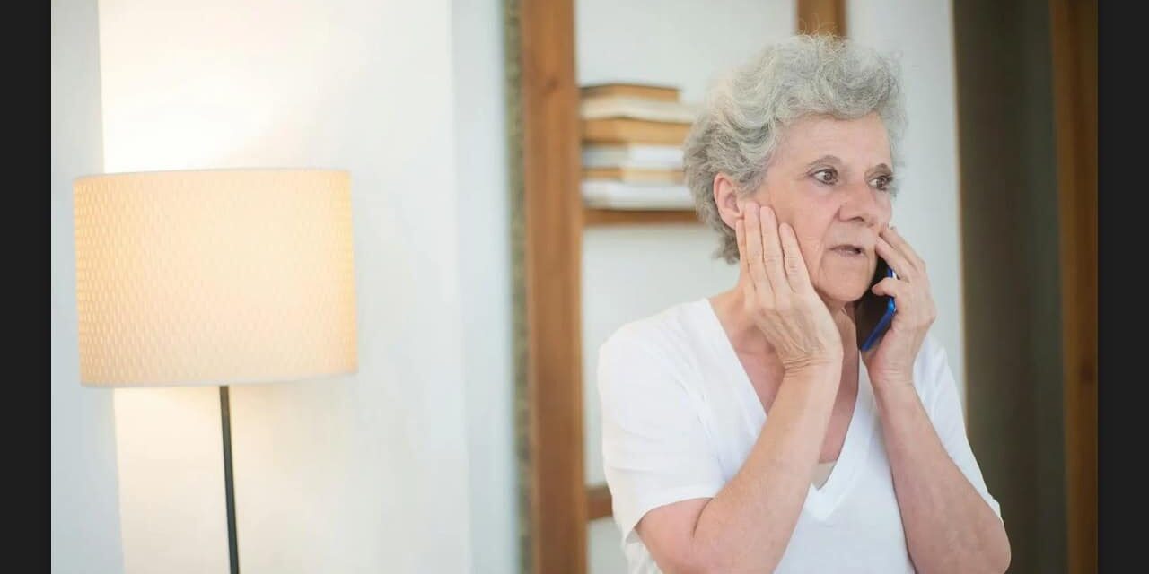 Arizona grandmother looking worried on the phone - Andrew Draayer of Andrew The Homebuyer can help