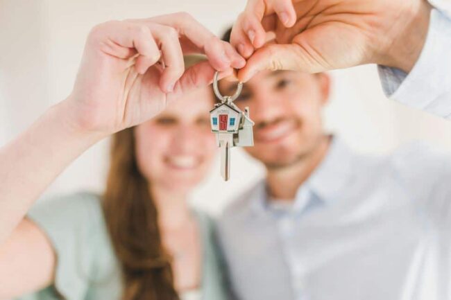 Couple Holding Keys to Home