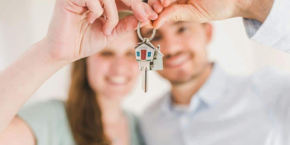 Couple Holding Keys to Home